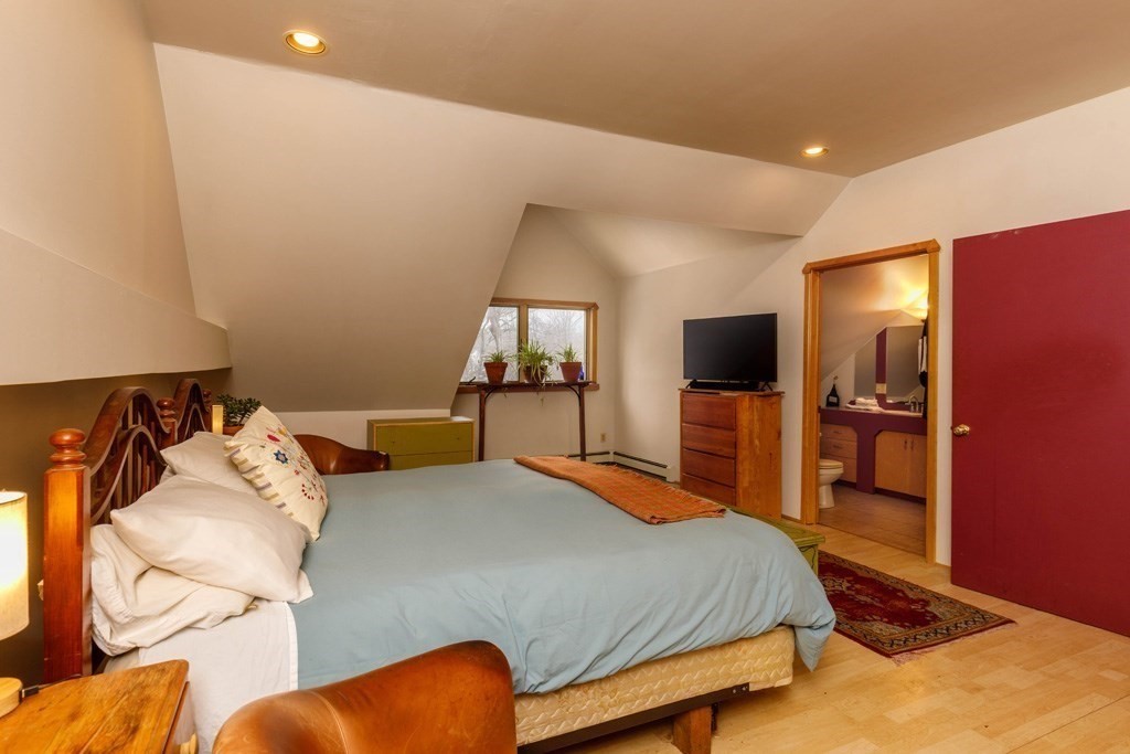 14 Travers Street Gardner, MA 01440 - Photo 7 of 17 a bedroom with a bed and a flat screen tv