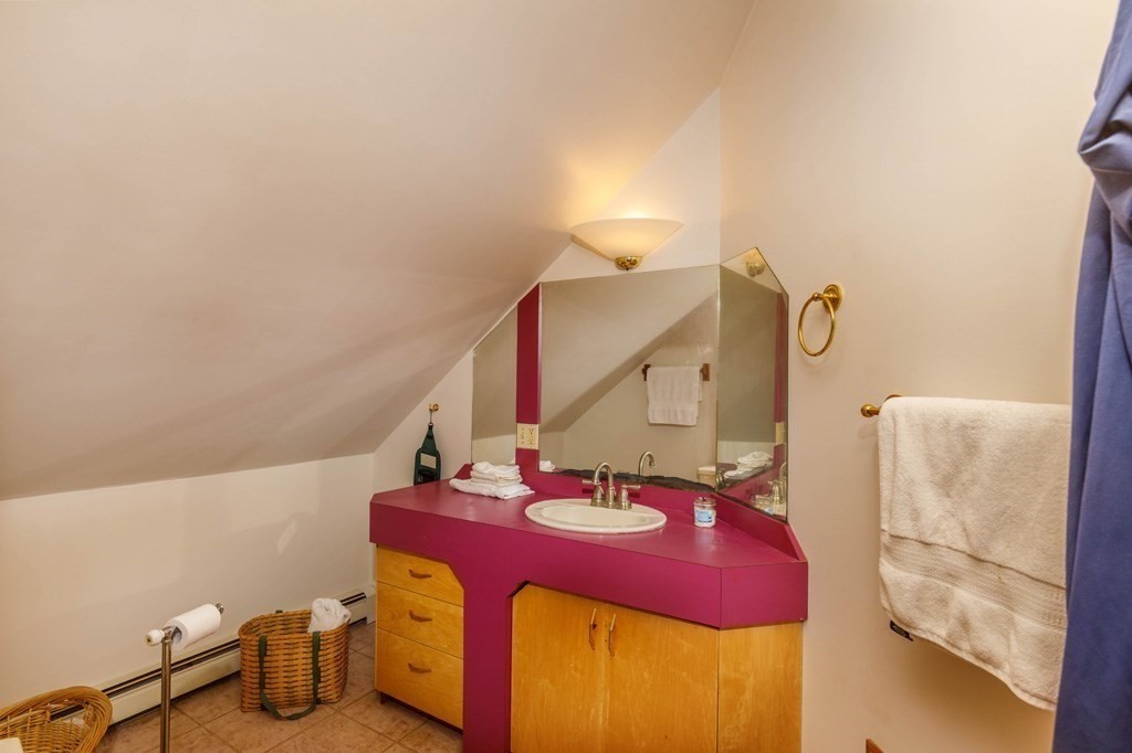 14 Travers Street Gardner, MA 01440 - Photo 8 of 17 a bathroom with a sink and a mirror