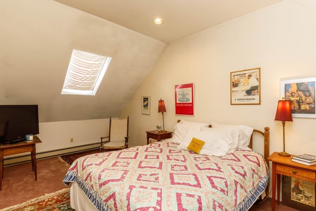 14 Travers Street Gardner, MA 01440 - Photo 10 of 17 a bedroom with a bed and wooden floor