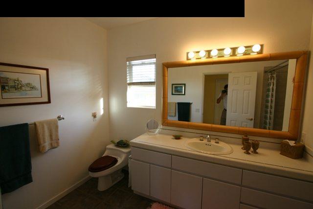 500 North Holokai Road Haiku, HI 96708 - Photo 20 of 30 a bathroom with a sink and a mirror