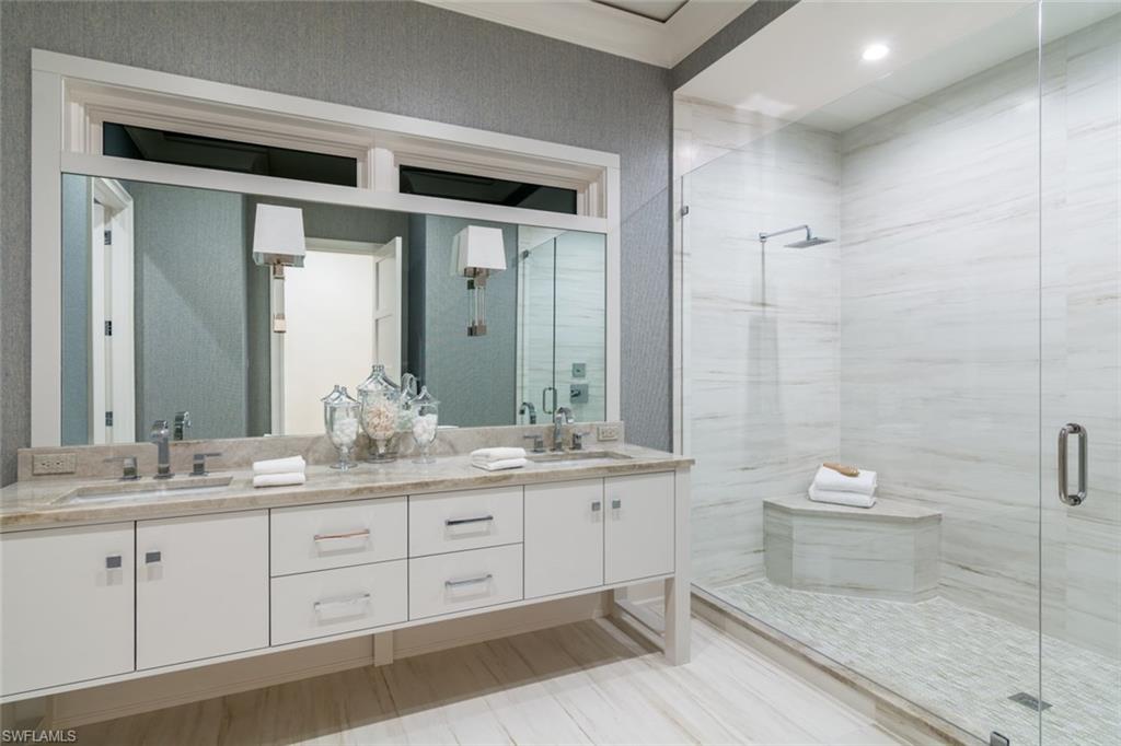 870 Nelson`s Walk Naples, FL 34102 - Photo 20 of 24 a bathroom with a double vanity sink and a mirror
