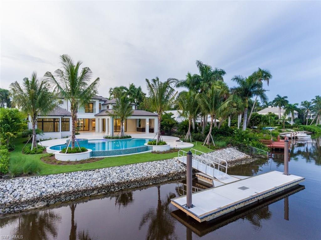 870 Nelson`s Walk Naples, FL 34102 - Photo 23 of 24 a view of a house with a yard and sitting area