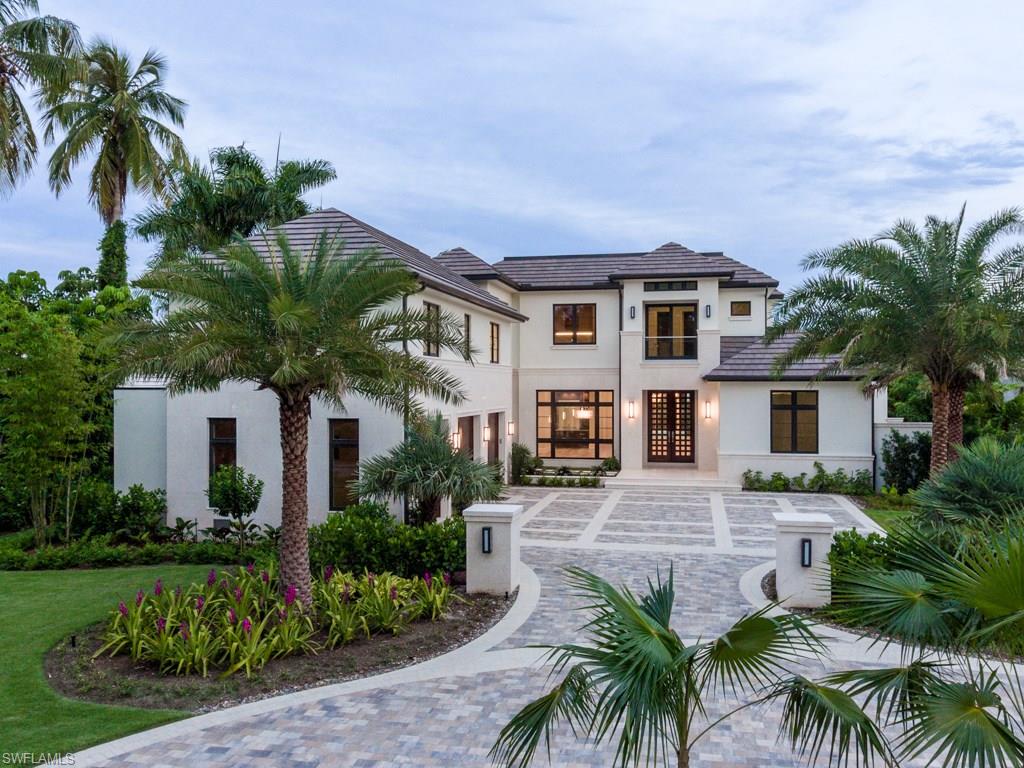 870 Nelson`s Walk Naples, FL 34102 - Photo 3 of 24 a house with palm tree in front of it