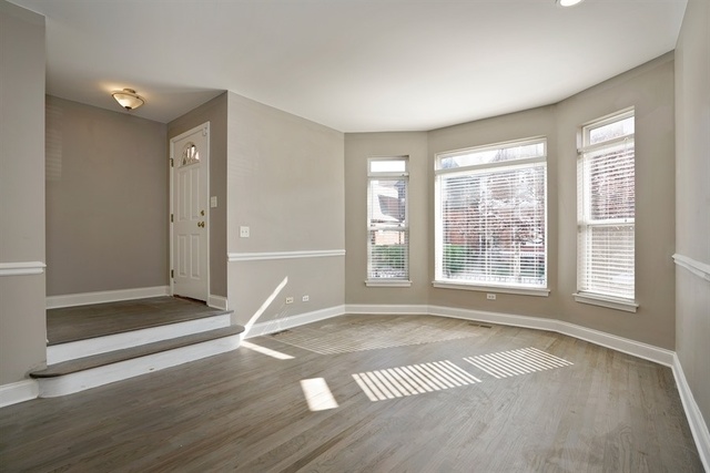 4152 South Berkeley Avenue Chicago, IL 60653 - Photo 2 of 15 a view of empty room with wooden floor and fan