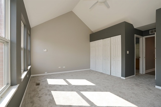 4152 South Berkeley Avenue Chicago, IL 60653 - Photo 9 of 15 a view of an empty room with a window