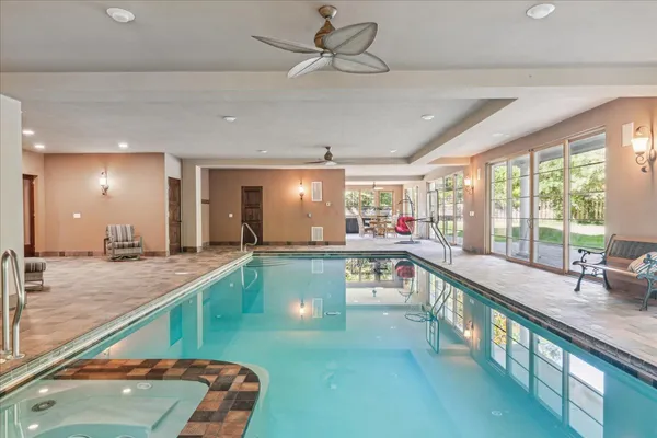a view of a swimming pool and wooden floor