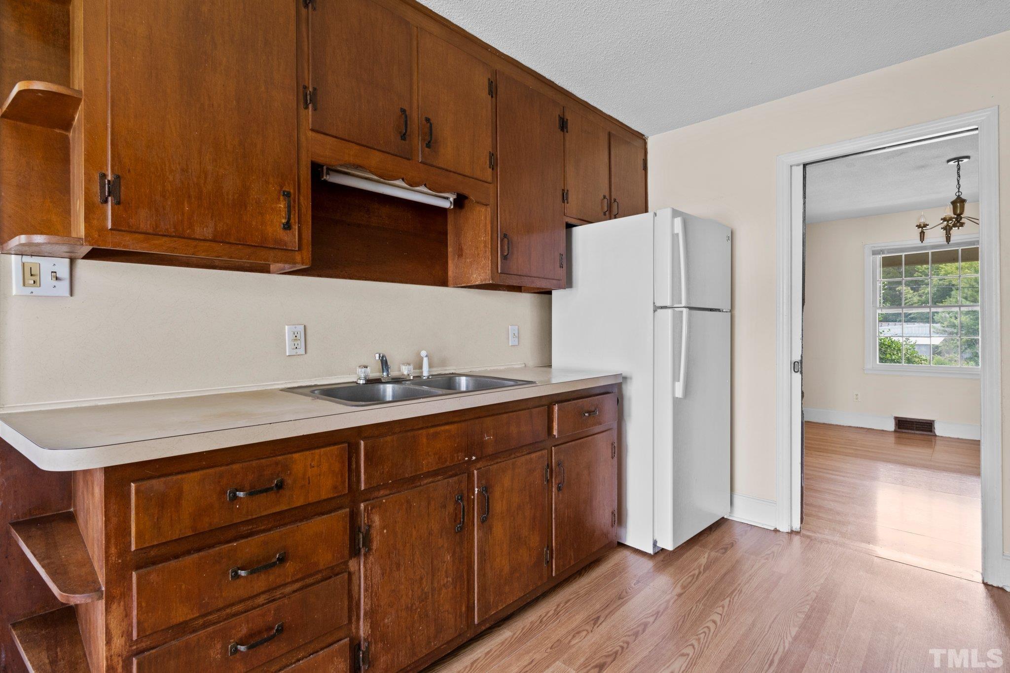104 West Tally Ho Road Stem, NC 27581 - Photo 13 of 25 a kitchen with stainless steel appliances granite countertop a refrigerator and a sink