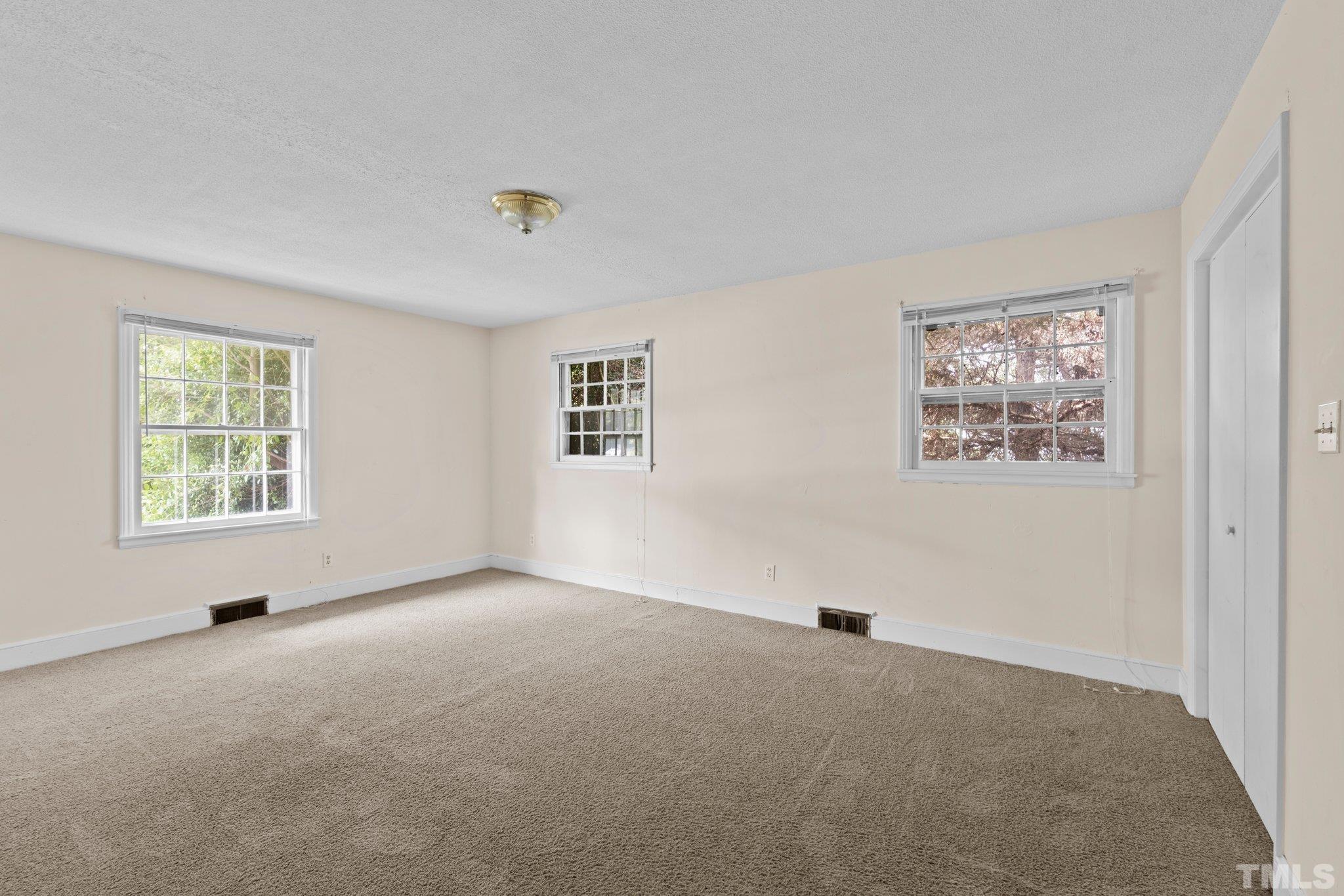 104 West Tally Ho Road Stem, NC 27581 - Photo 21 of 25 a view of an empty room with a window