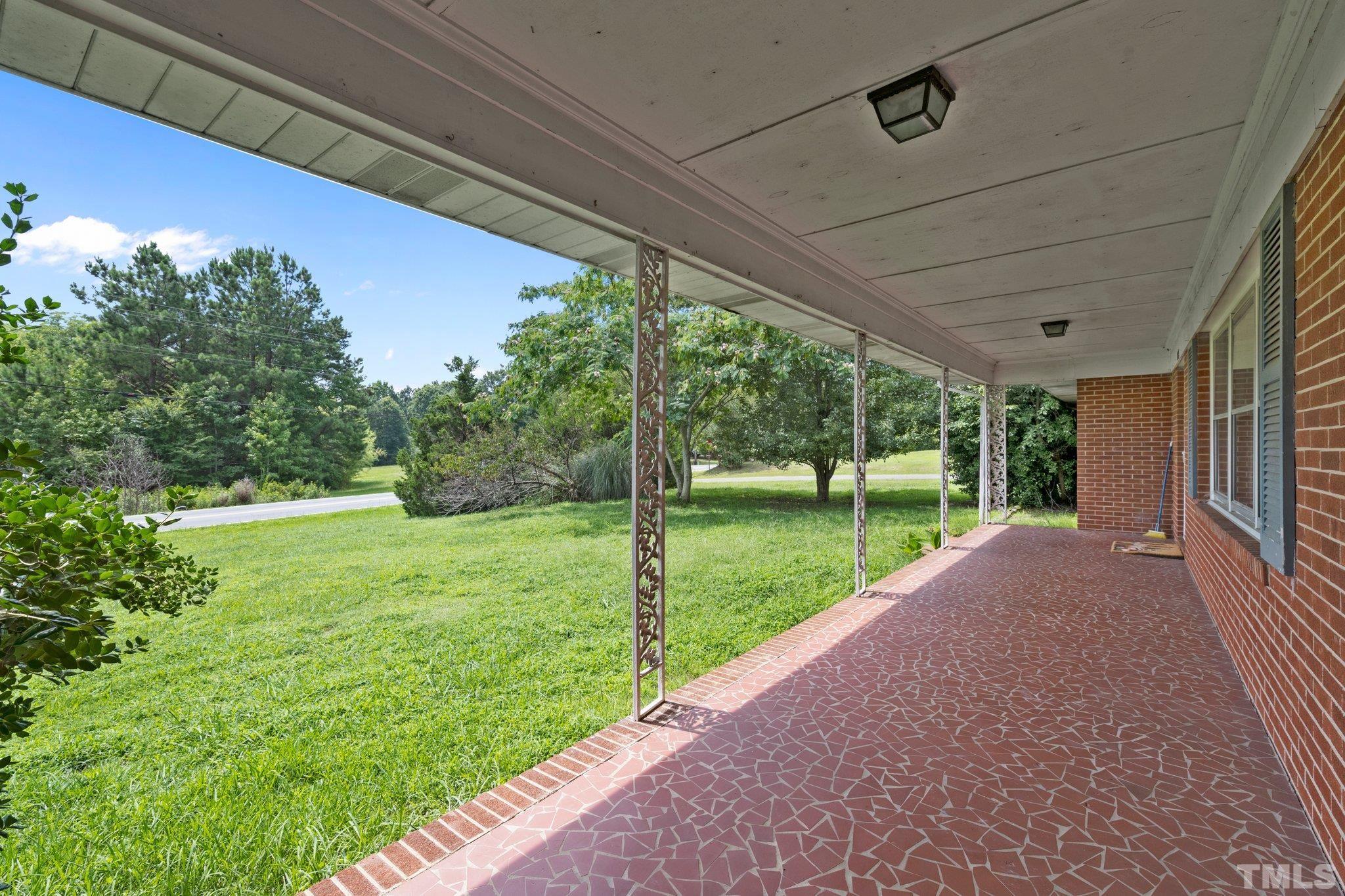 104 West Tally Ho Road Stem, NC 27581 - Photo 23 of 25 a view of a house with a yard