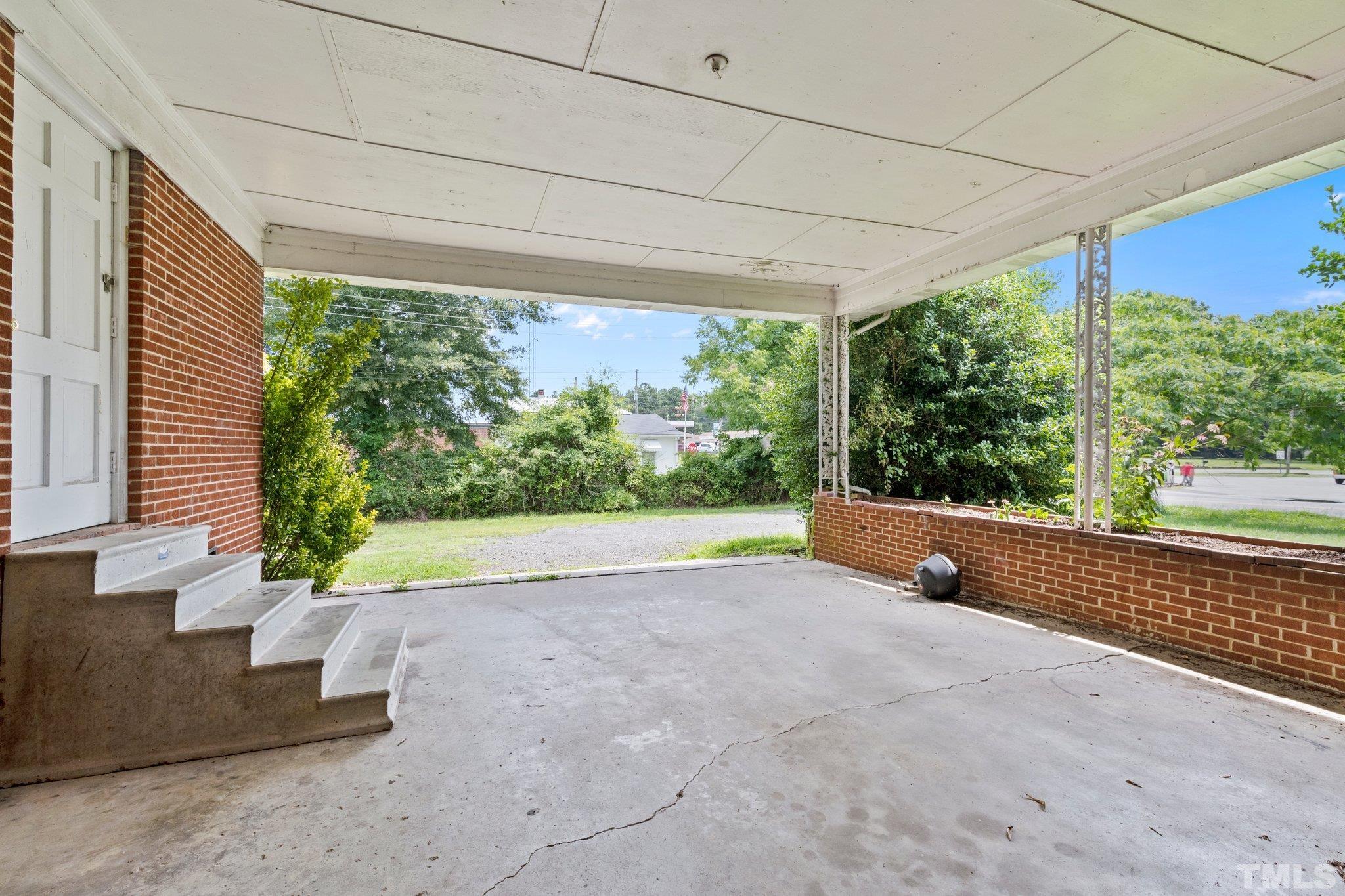 104 West Tally Ho Road Stem, NC 27581 - Photo 25 of 25 a view of a garden with a outdoor space