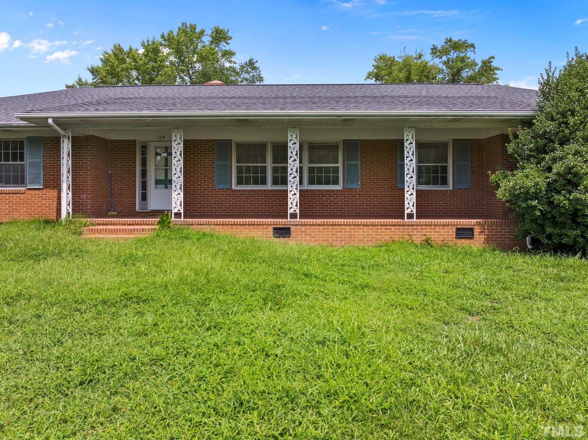 104 West Tally Ho Road Stem, NC 27581 - Photo 3 of 25 a front view of a house with a yard