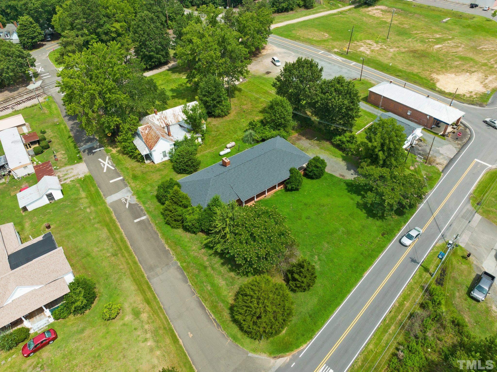 104 West Tally Ho Road Stem, NC 27581 - Photo 5 of 25 a view of a yard with potted plants