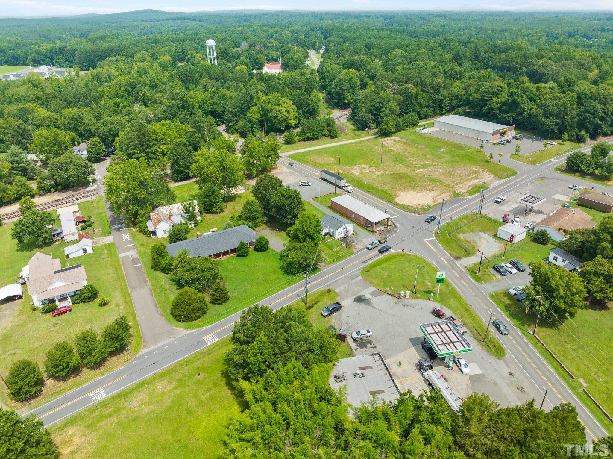 104 West Tally Ho Road Stem, NC 27581 - Photo 9 of 25 an aerial view of a pool yard and mountain view in back