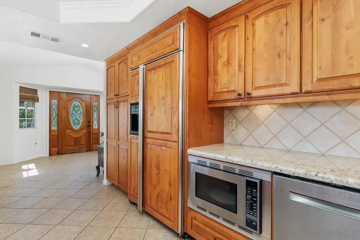 15121 Country Hill Road Poway, CA 92064 - Photo 12 of 40 a view of a kitchen with utility room