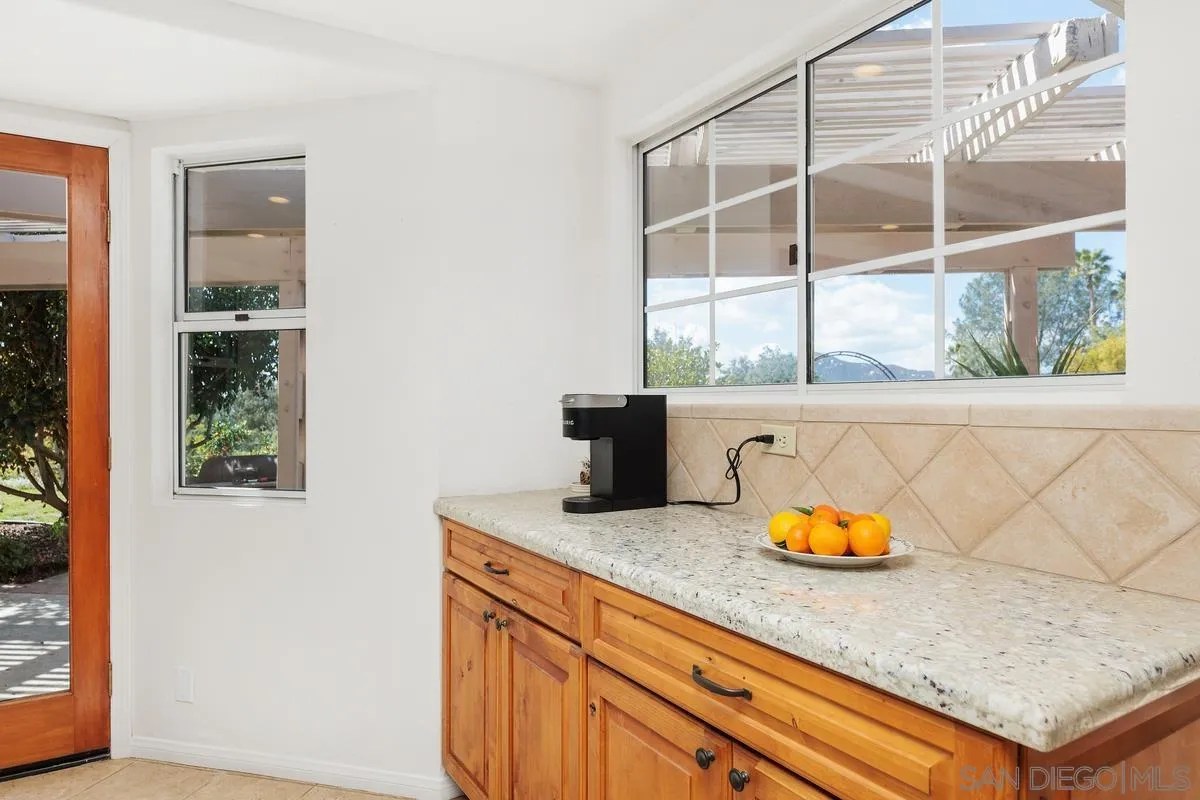 15121 Country Hill Road Poway, CA 92064 - Photo 13 of 40 an outdoor view with a sink and wooden floor