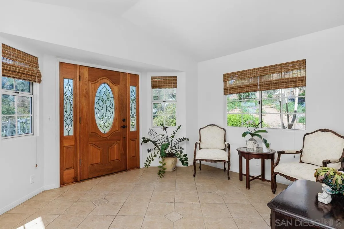 15121 Country Hill Road Poway, CA 92064 - Photo 14 of 40 a living room with furniture and a window