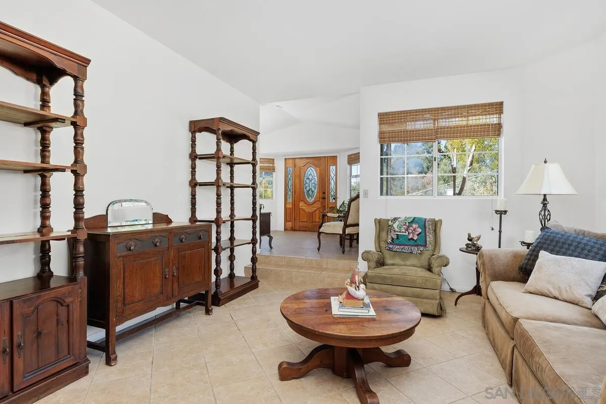 15121 Country Hill Road Poway, CA 92064 - Photo 16 of 40 a living room with furniture and a wooden floor