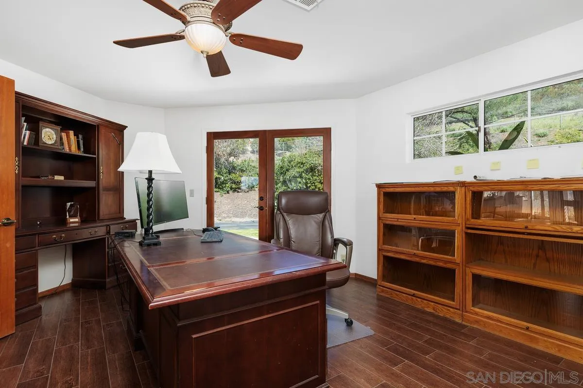 15121 Country Hill Road Poway, CA 92064 - Photo 17 of 40 a view of a dining room with furniture and wooden floor