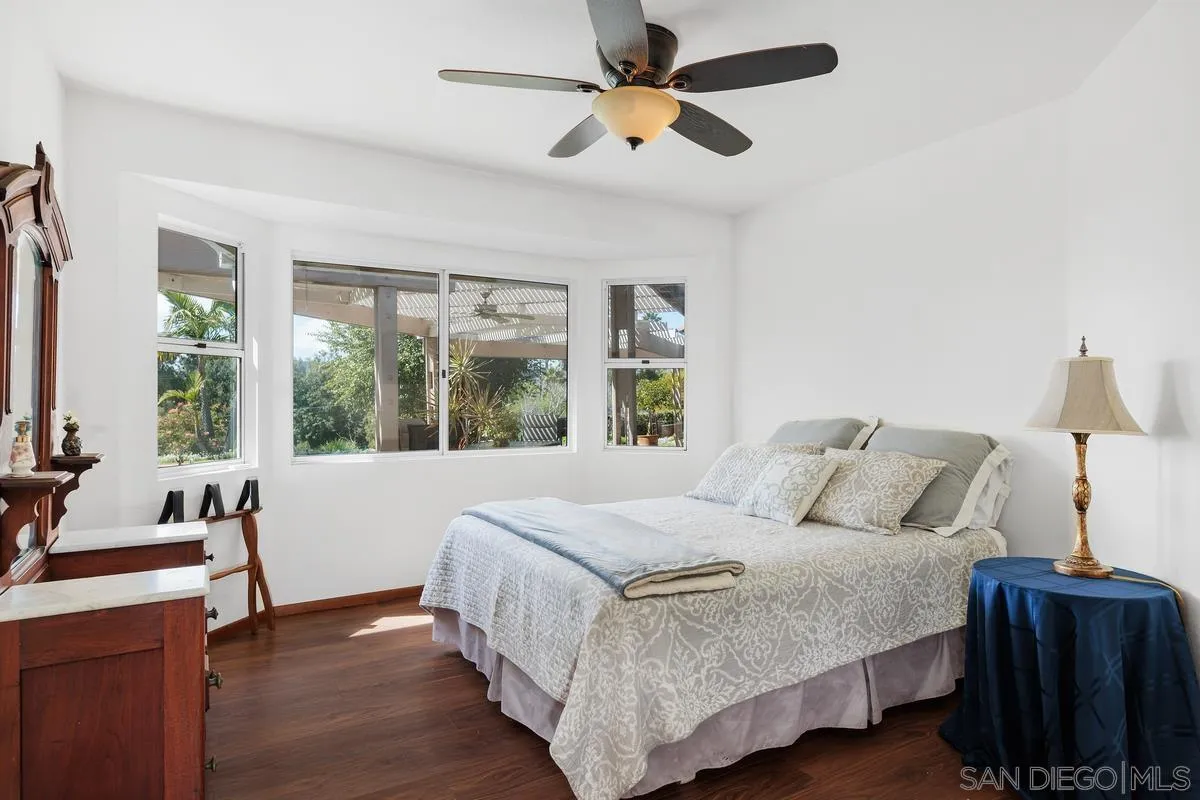 15121 Country Hill Road Poway, CA 92064 - Photo 23 of 40 a bedroom with a bed and wooden floor