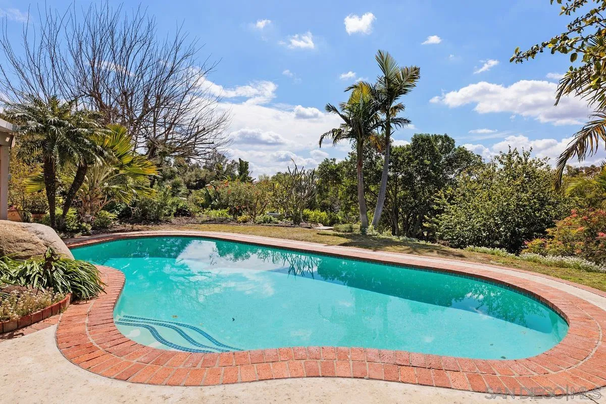15121 Country Hill Road Poway, CA 92064 - Photo 29 of 40 a view of a swimming pool with a yard