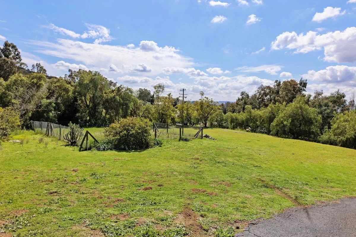 15121 Country Hill Road Poway, CA 92064 - Photo 34 of 40 a view of a field with a building in the background