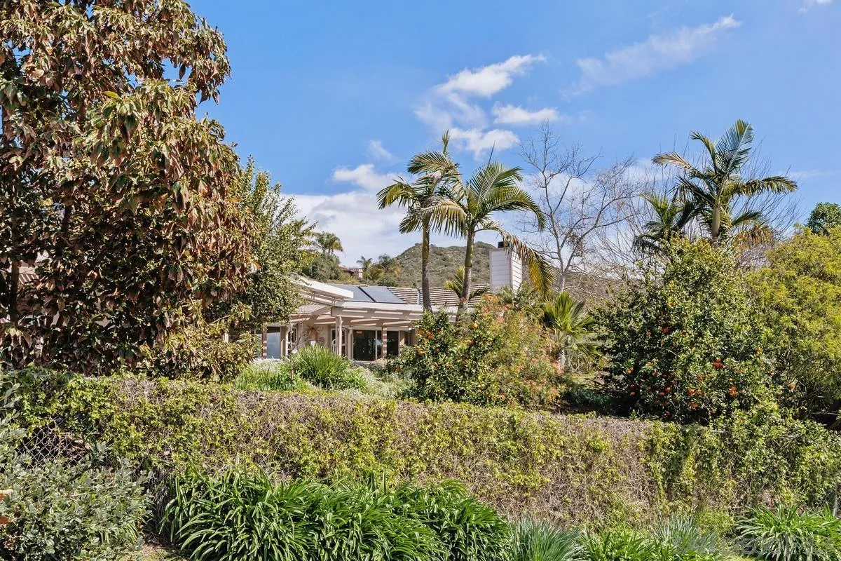 15121 Country Hill Road Poway, CA 92064 - Photo 38 of 40 a view of a house with a yard and garden