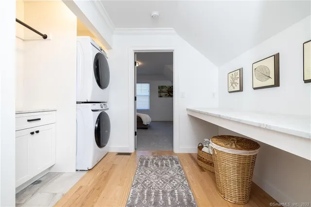 a bed room with a bed and a night stand