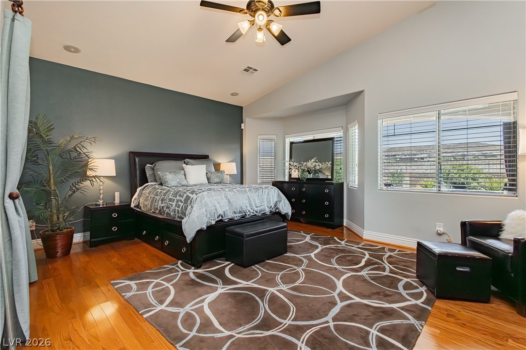 2256 Dogwood Ranch Avenue Henderson, NV 89052 - Photo 35 of 51 Slanted ceilings and rich hardwood floors define this well-appointed bedroom.
