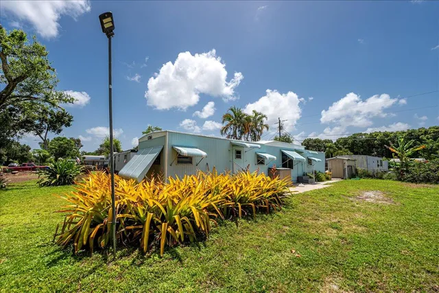 a view of a swimming pool with a table and chairs