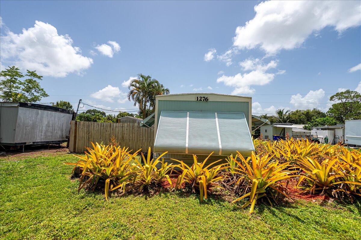 1276 Southwest Tropical Terrace Stuart, FL 34997 - Photo 21 of 27 a view of a backyard