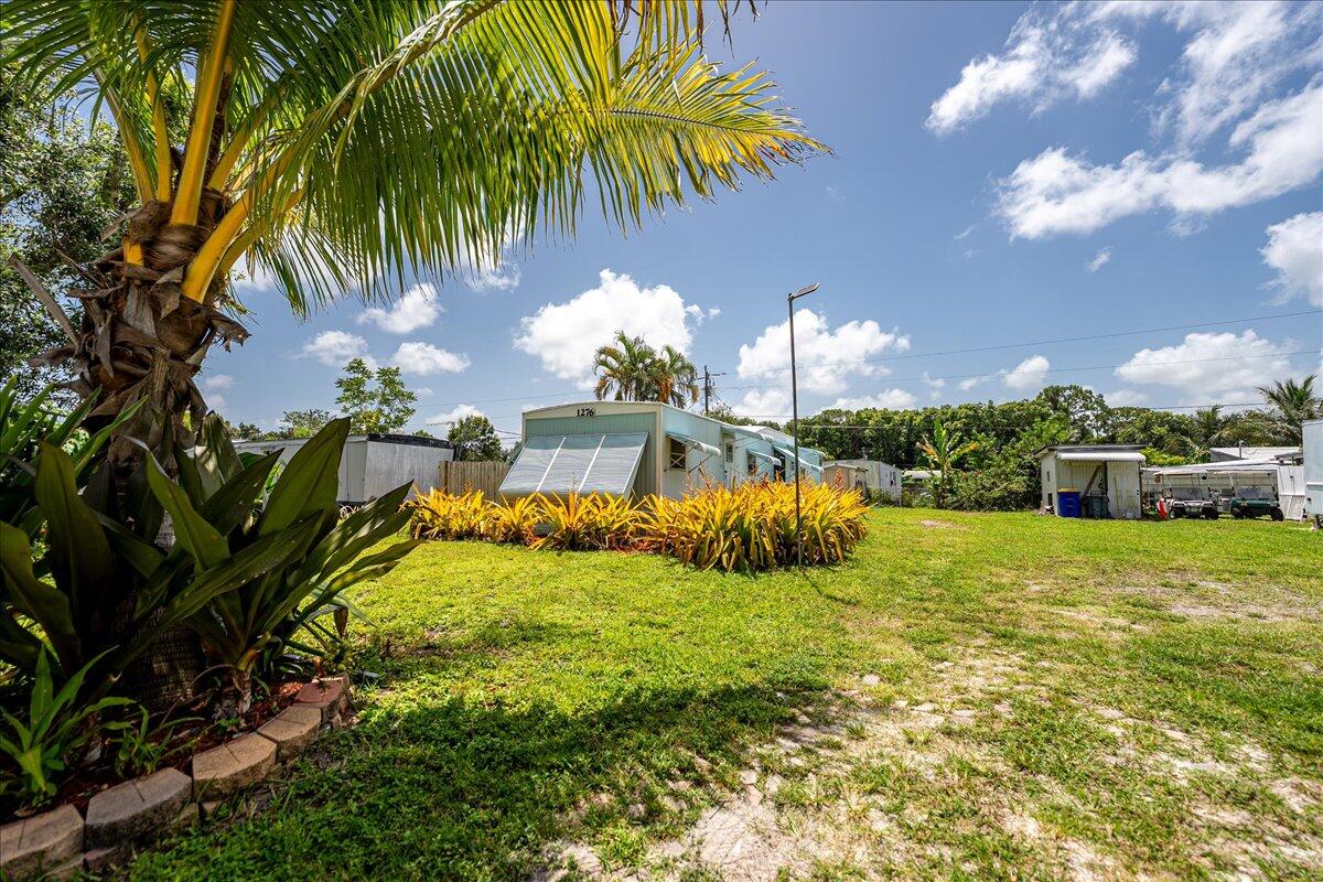 1276 Southwest Tropical Terrace Stuart, FL 34997 - Photo 4 of 27 a view of a garden