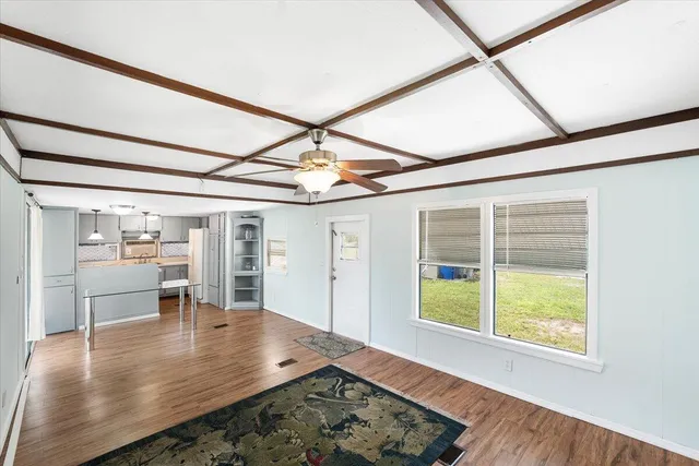 a view of a living room and dining room