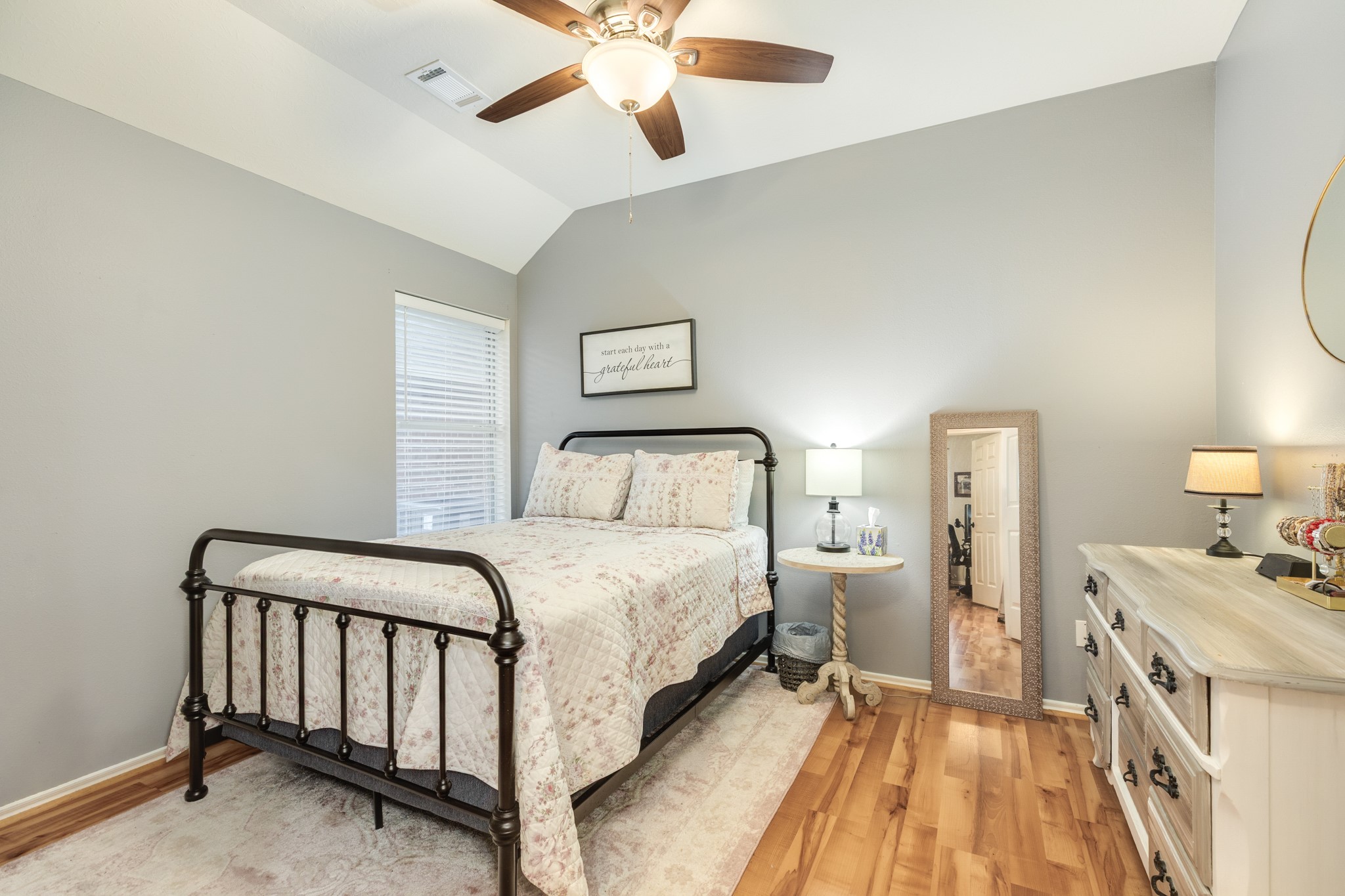 13808 Stark Bridge Lane Rosharon, TX 77583 - Photo 19 of 39 Secondary bedroom features fresh paint, brand-new laminate flooring, and a newly installed ceiling fan.
