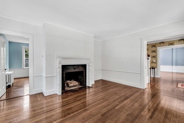 81 Fearing Road Hingham, MA 02043 - Photo 14 of 42 a living room with wooden floor and a fireplace