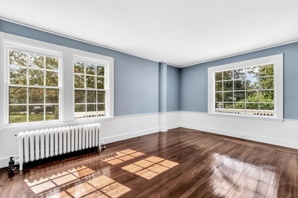 81 Fearing Road Hingham, MA 02043 - Photo 18 of 42 an empty room with wooden floor and windows