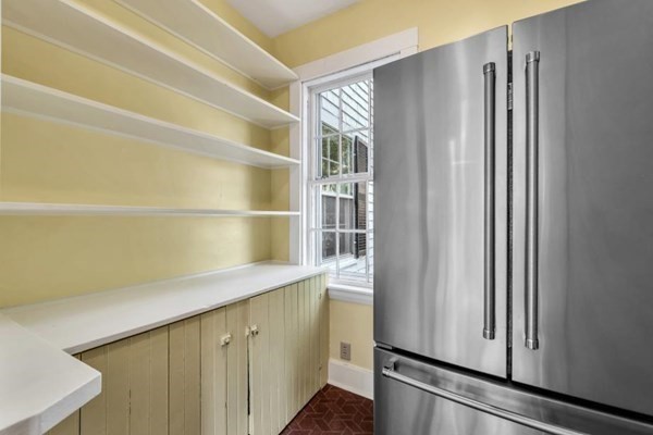 81 Fearing Road Hingham, MA 02043 - Photo 21 of 42 a hallway with white cabinets and wooden floor