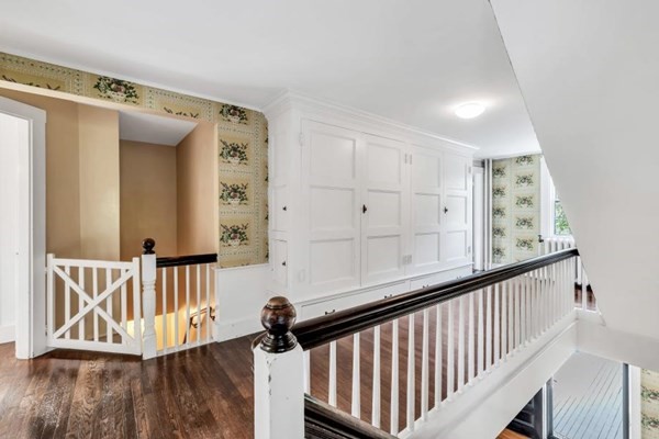 81 Fearing Road Hingham, MA 02043 - Photo 25 of 42 a view of a hallway with wooden floor and staircase