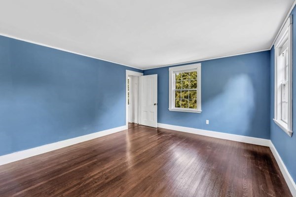 81 Fearing Road Hingham, MA 02043 - Photo 32 of 42 an empty room with wooden floor and windows