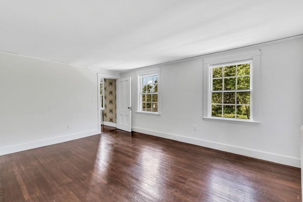 81 Fearing Road Hingham, MA 02043 - Photo 33 of 42 a view of an empty room with wooden floor and a window