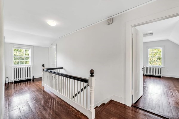 81 Fearing Road Hingham, MA 02043 - Photo 34 of 42 a view of a hallway with wooden floor and windows