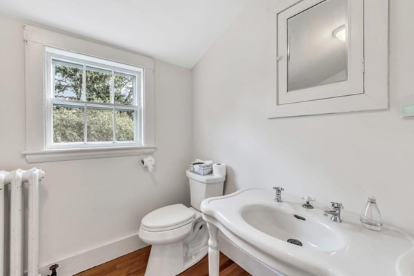 81 Fearing Road Hingham, MA 02043 - Photo 36 of 42 a bathroom with a sink mirror and toilet