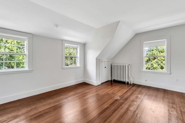 81 Fearing Road Hingham, MA 02043 - Photo 38 of 42 a view of an empty room with wooden floor and a window