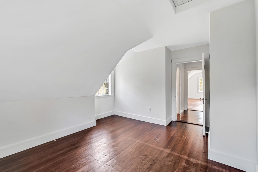 81 Fearing Road Hingham, MA 02043 - Photo 39 of 42 an empty room with wooden floor and windows