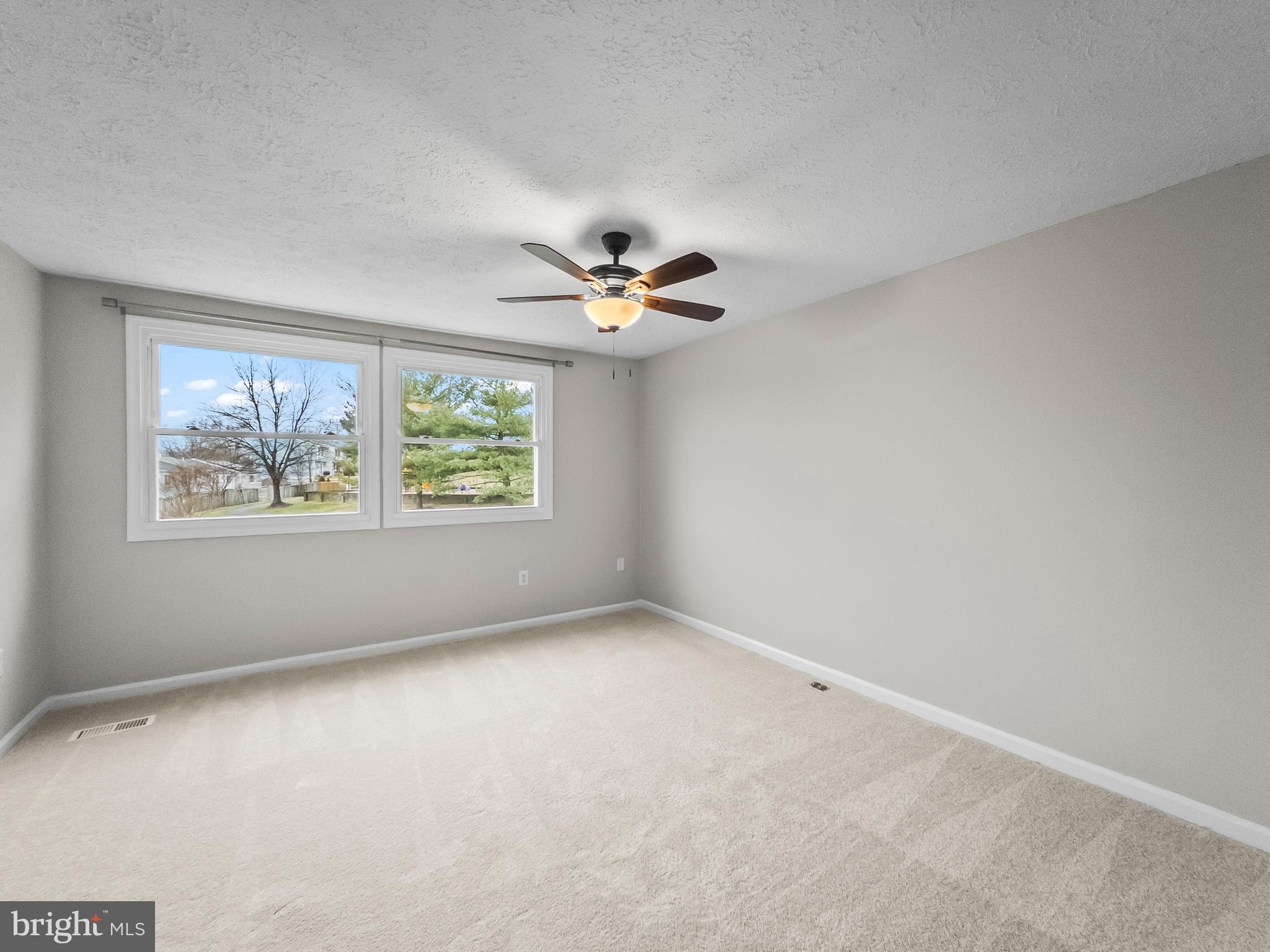 10110 Shelldrake Circle Damascus, MD 20872 - Photo 14 of 35 an empty room with window and ceiling fan