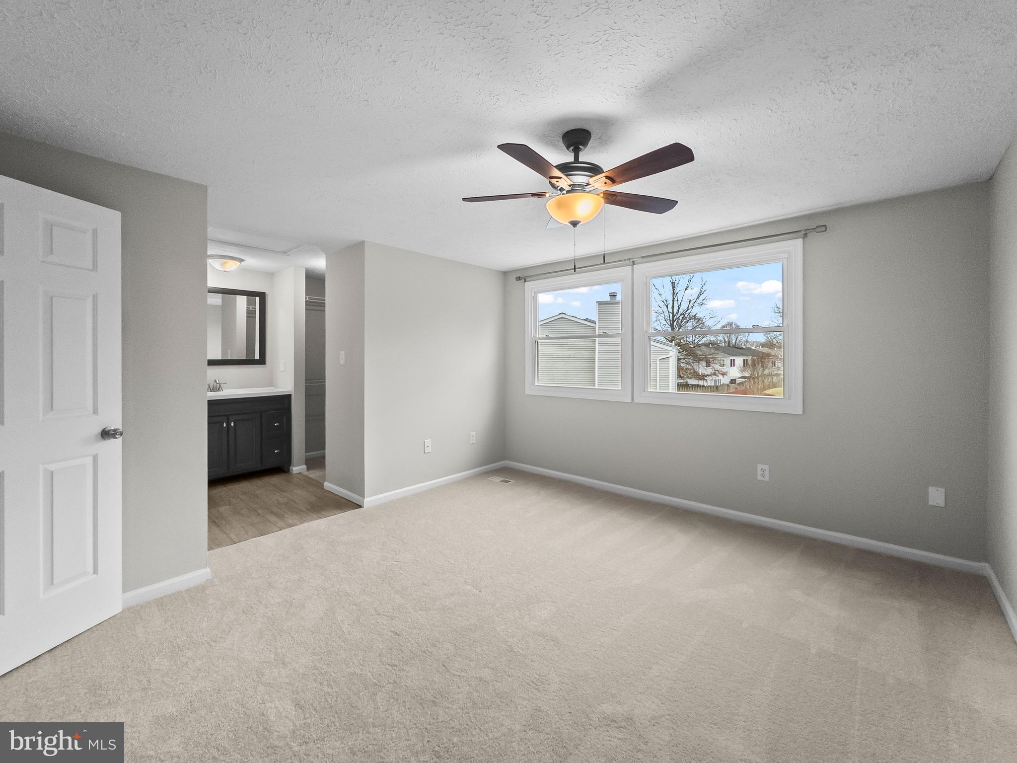 10110 Shelldrake Circle Damascus, MD 20872 - Photo 15 of 35 a view of empty room with windows and ceiling fan