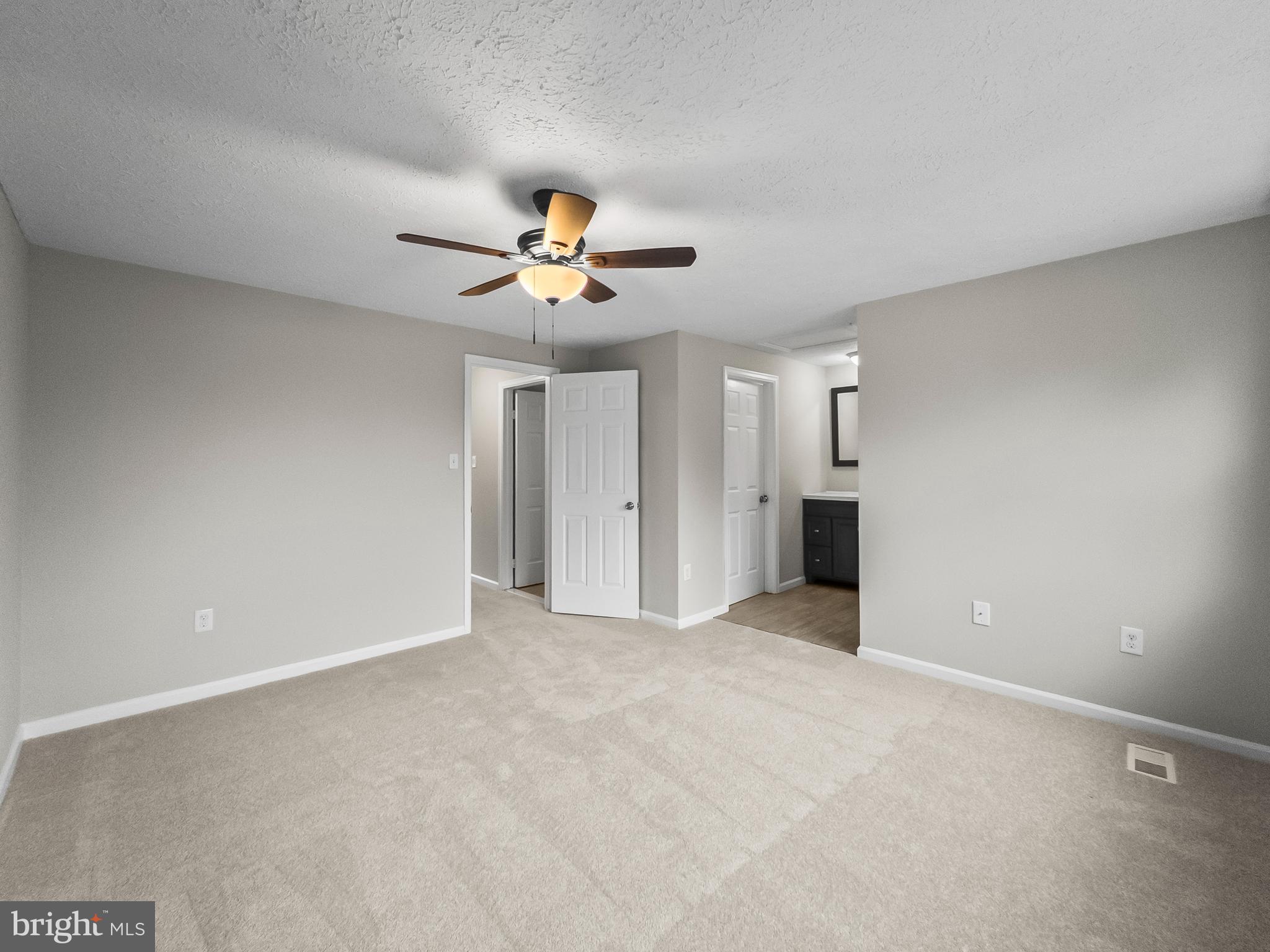 10110 Shelldrake Circle Damascus, MD 20872 - Photo 16 of 35 a view of an empty room with a ceiling fan