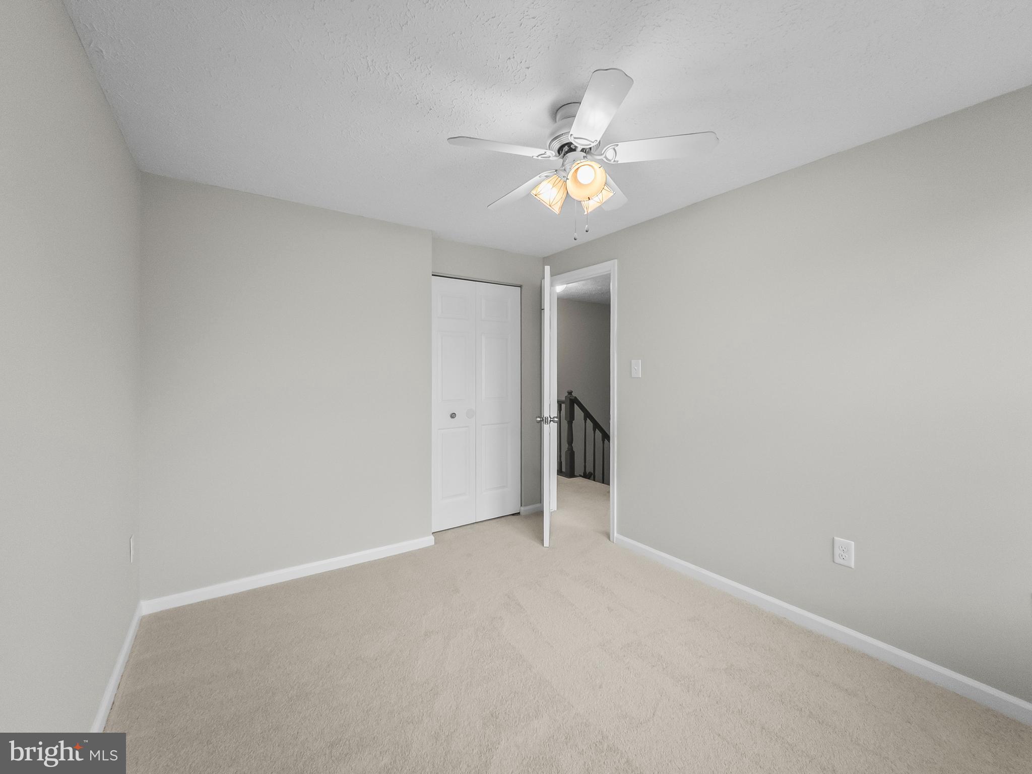 10110 Shelldrake Circle Damascus, MD 20872 - Photo 21 of 35 a view of an empty room and chandelier fan