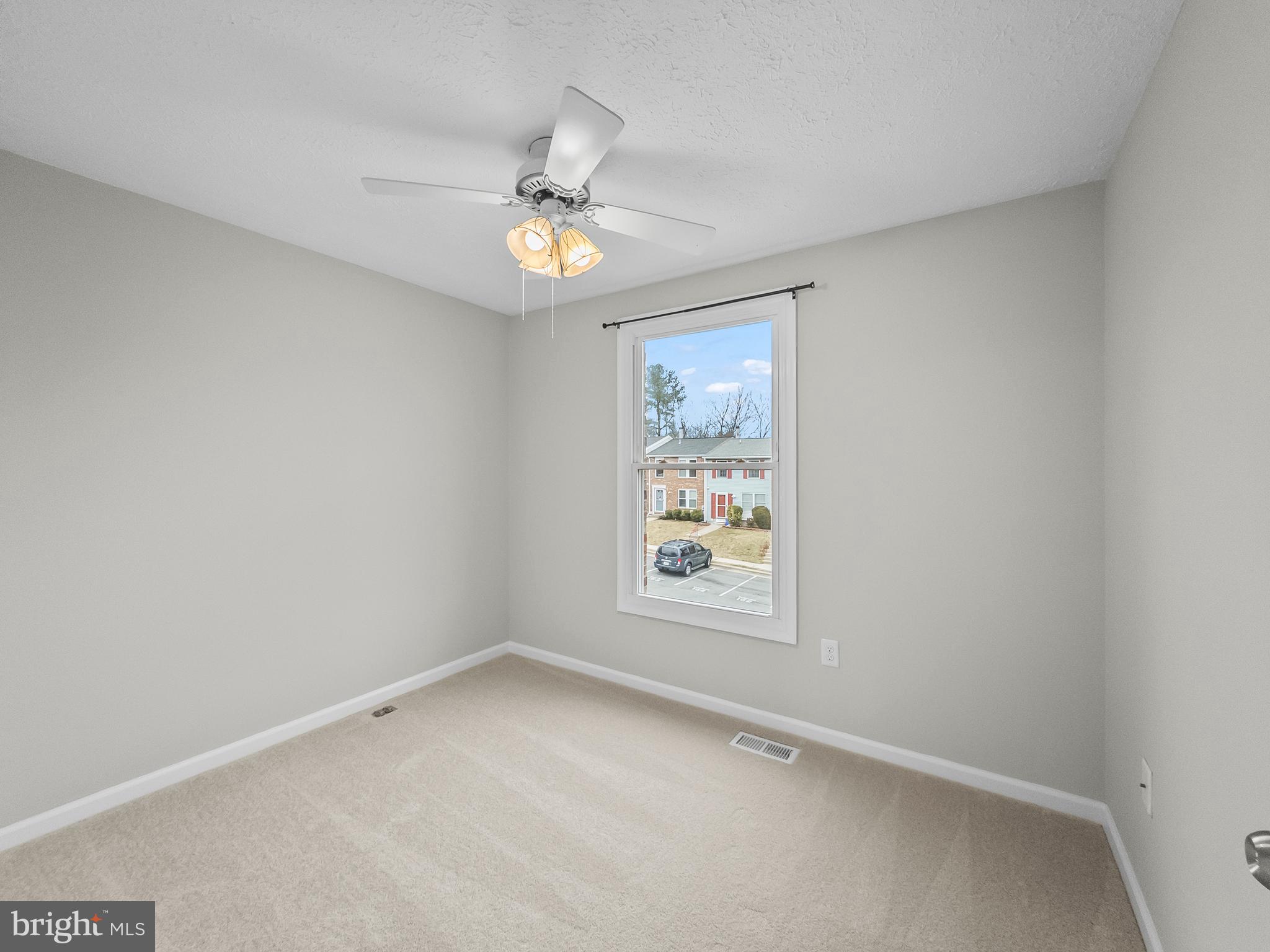 10110 Shelldrake Circle Damascus, MD 20872 - Photo 22 of 35 an empty room with a window and ceiling fan