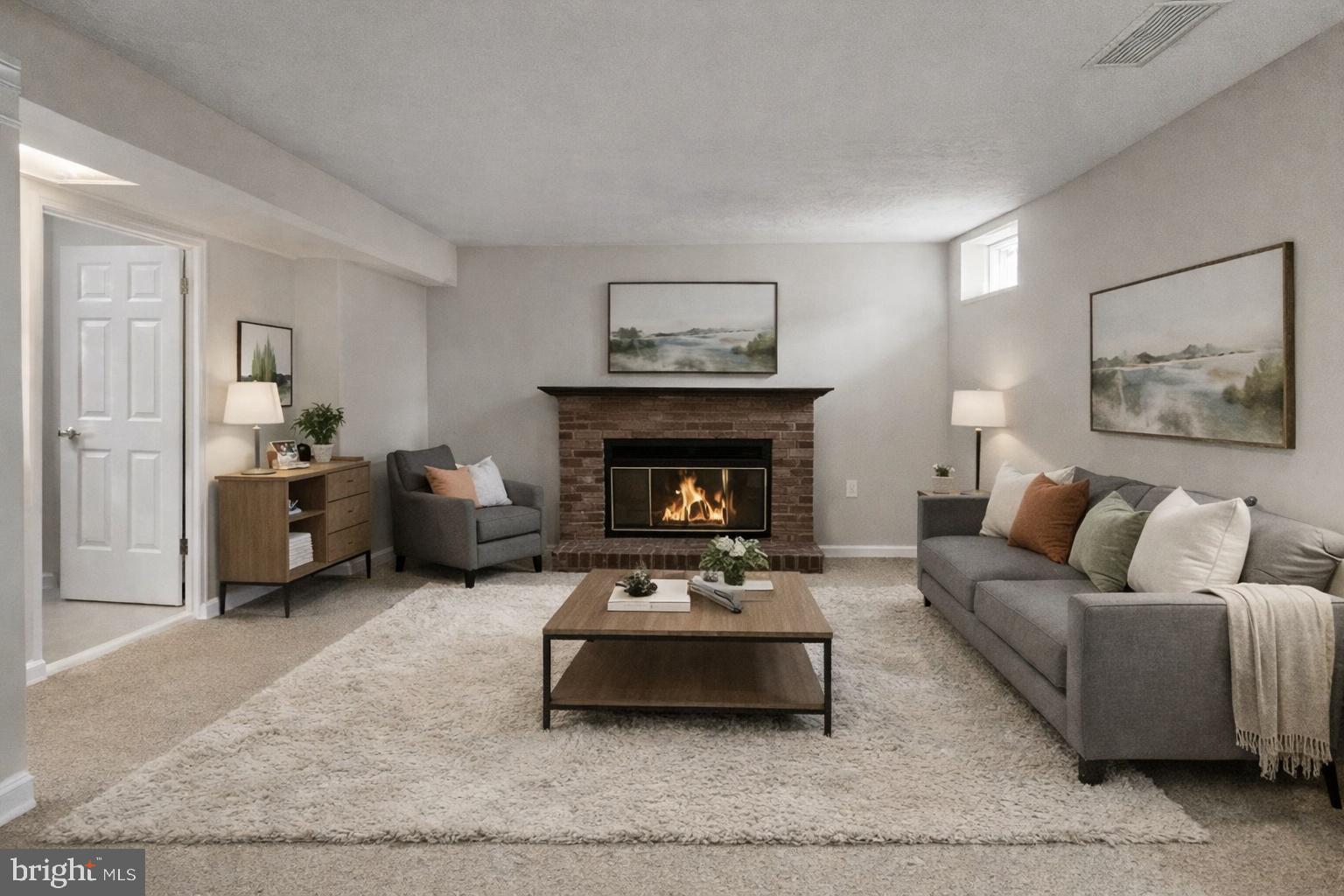 10110 Shelldrake Circle Damascus, MD 20872 - Photo 26 of 35 a living room with furniture and a fireplace