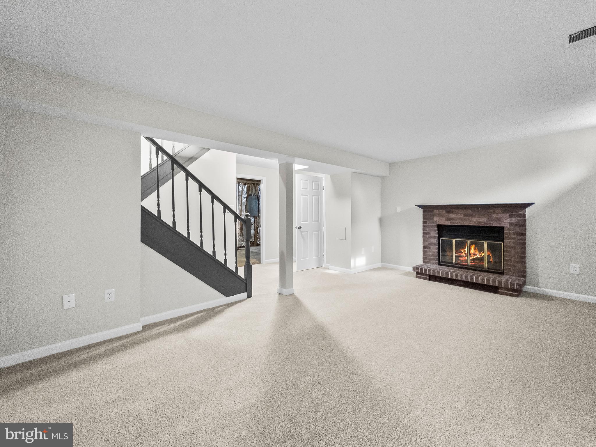 10110 Shelldrake Circle Damascus, MD 20872 - Photo 28 of 35 a view of an empty room with a fireplace